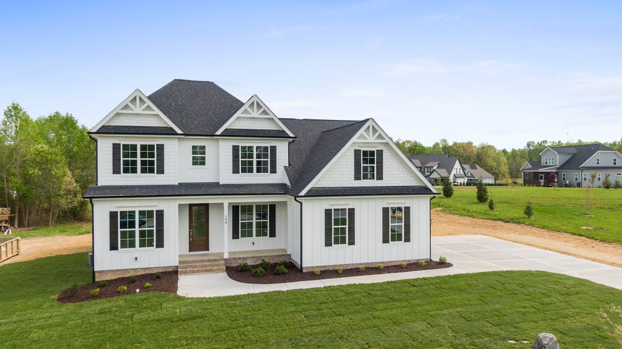 Aerial view of a modern two-story house with spacious lawn in Youngsville, NC.